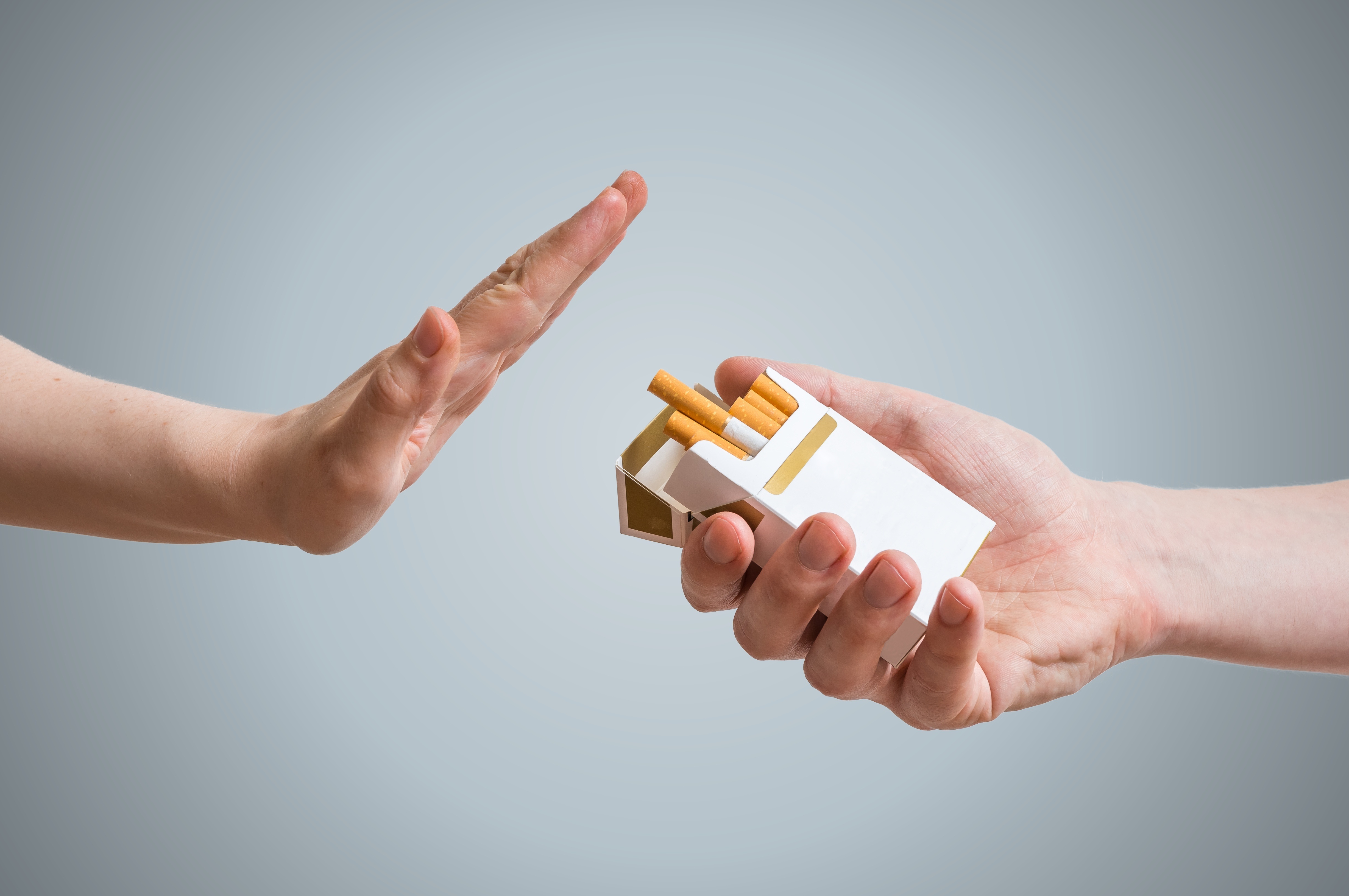  Hand gesturing to say no to cigarettes 