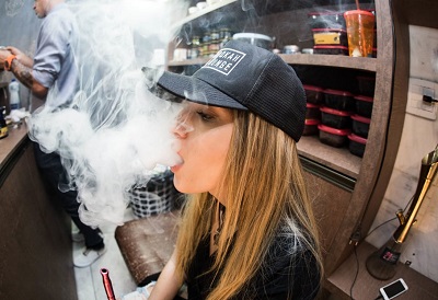 Young Woman Producing Clouds of Vape