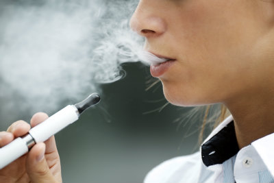 Woman Vaping and E Cigarette