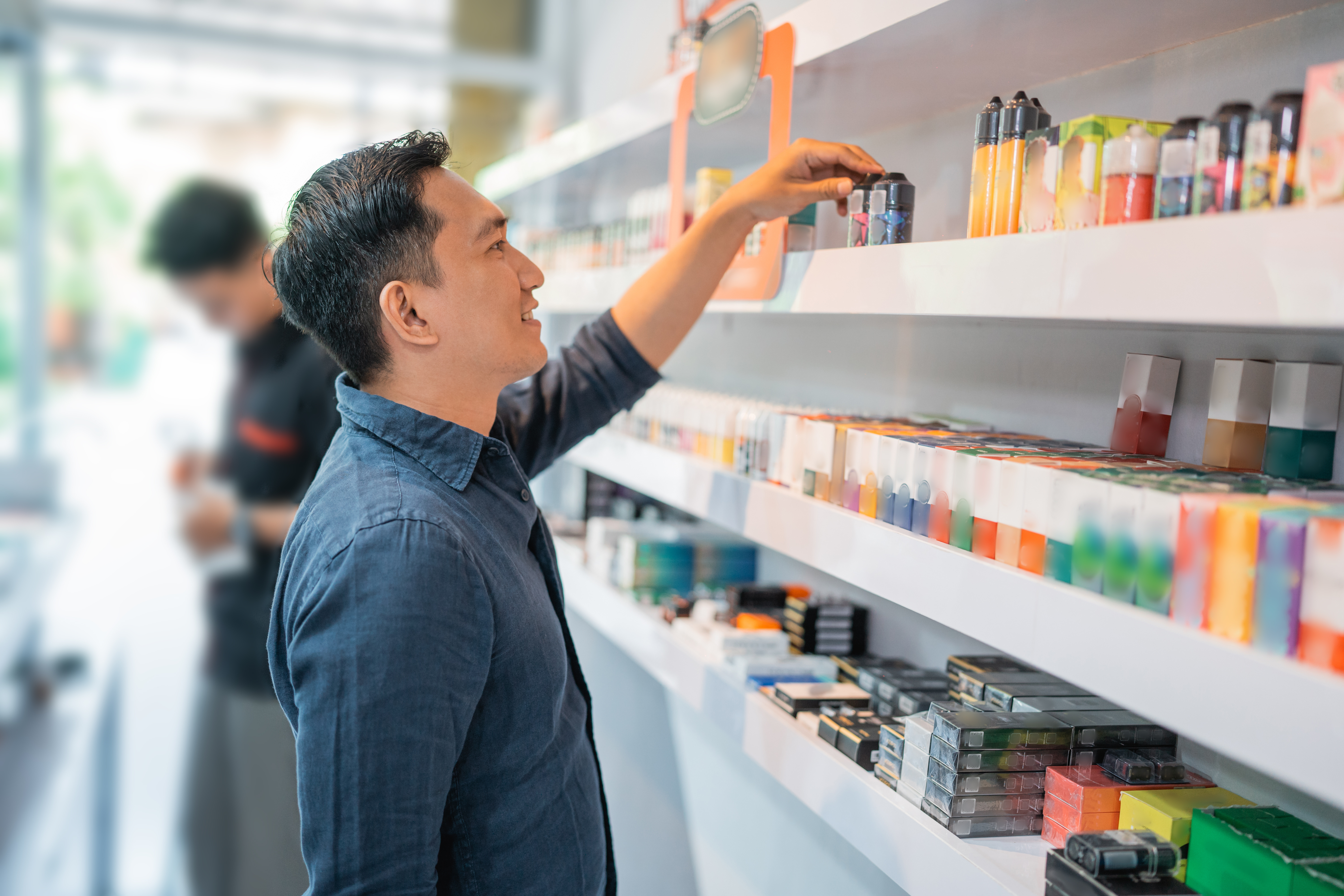 E-liquid bottles stored on a shelf away from heat and light