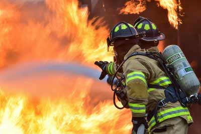 Firefighters putting out a fire cause by cigarette