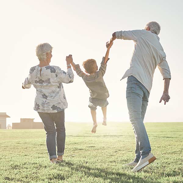 Grandparents playing with grand child