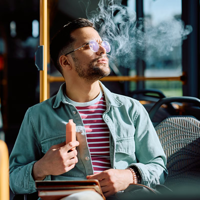 Man Vaping Disposable With a Burnt Taste