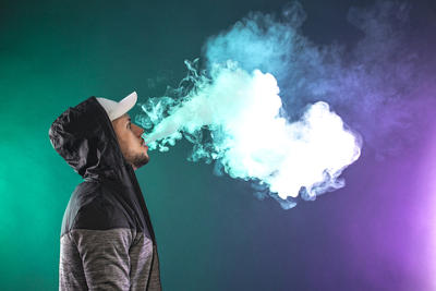 Man Blowing Clouds of Vapour