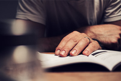 Man reading vaping manual