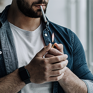 Man Smoking a Cigarette to Cope With Stress