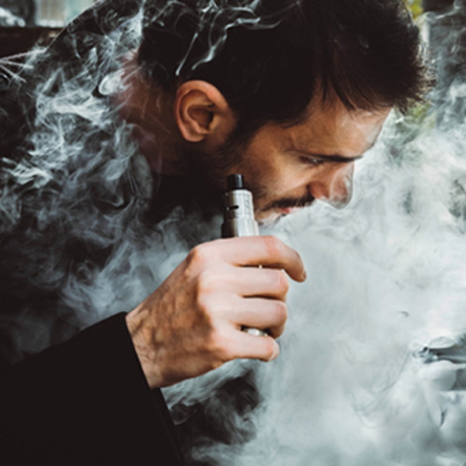 Man Vaping a Sub-Ohm Device