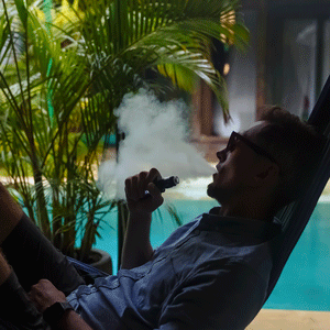 Man Vaping on Summer Hammock