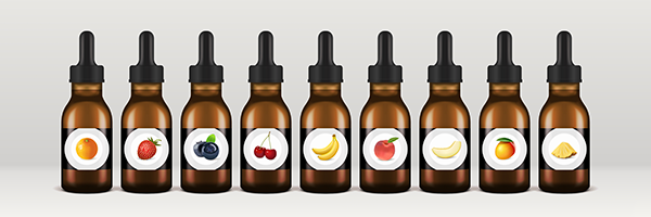 Multiple E-Liquid Bottles Lined Up With an Assortment of Fruit-Inspired Labels