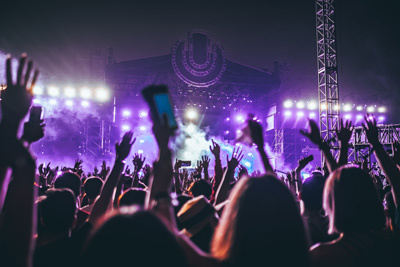 People Celebrating Music at an Outdoor Festival