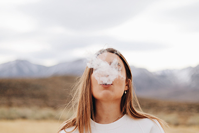 woman vaping outside