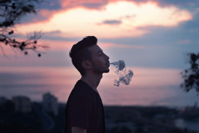 Man blowing clouds