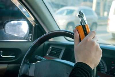 Vaper driving with e-cigarette on holiday