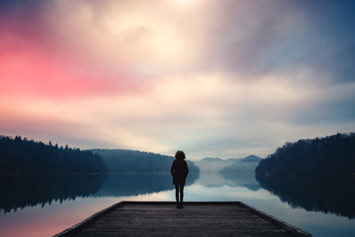 Vaper-standing-by-the-lake-watching-the-sunset