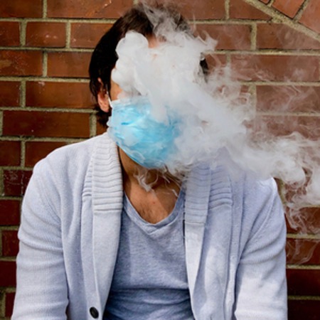 vaping with a mask on for covid-19 protection
