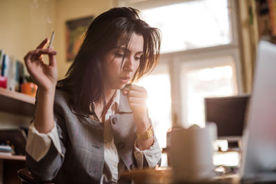 Woman-Coughing-from-cigarettes-in-a-smoking-relapse