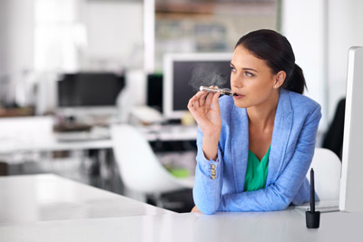 Woman-having-a-quick-vape-between-meetings-at-work