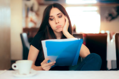 Woman Reading About Vaping