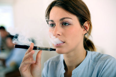 Woman vaping with an electronic cigarette